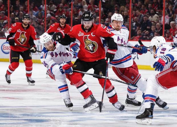 Erik Karlsson battles through Rangers players in Game 1 of second round play in the 2017 playoffs.