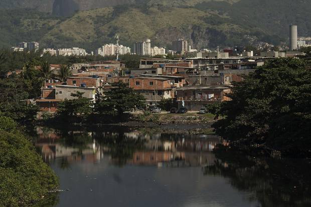 Residences in the Mare favela next to the Cunha channel throw sewage directly in Guanabara Bay waters.