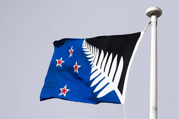 The alternative designed New Zealand flag flies on a building in the central business district in Wellington on March 24, 2016.