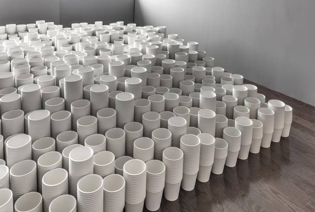 Visitors to Roula Partheniou’s exhibit Cup and Ball in Toronto first encounter a hill of what look like Dixie cups, arranged in a tidy grid of undulating stacks.