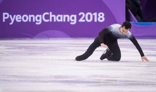 Canada's Patrick Chan falls during his short program in the men's portion of the figure skating team competition at the Pyeonchang Winter Olympics Friday, February 9, 2018 in Gangneung, South Korea.