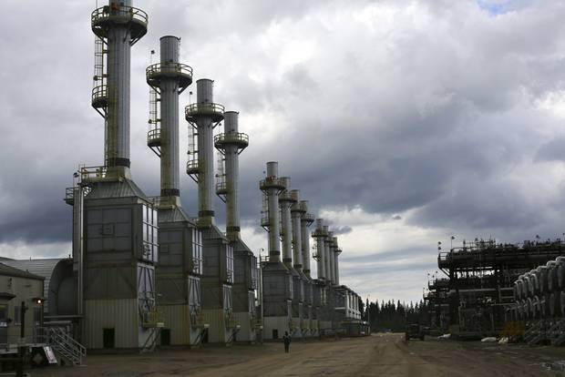 Rows of steam generating plants at Cenovus Energy's Christina Lake oil sands operation in Christina Lake, Alberta, Canada, June 12, 2013.