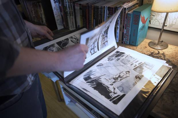 Lemire looks through artwork for Roughneck, in his Toronto studio.