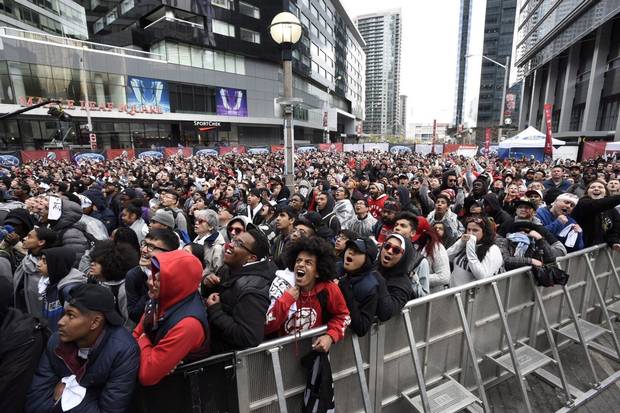 Toronto Raptors' fans watch the action on the big screen outside the Air Canada Centre.