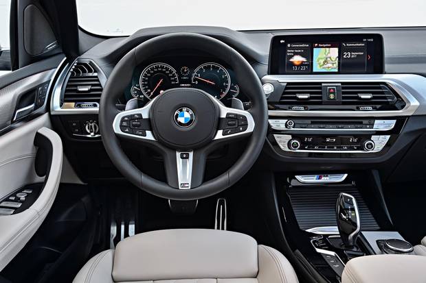 The leatherette on the dashboard and wood trim on the doors make the X3 feel more luxurious.