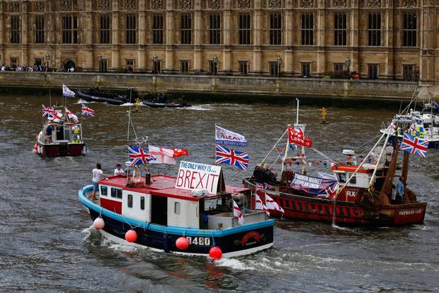 Fishermen and campaigners for the Leave campaign demonstrate in boats outside the Houses of Parliament in London on June 15, 2016.