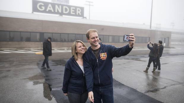 Irene Sankoff, left, and David Hein, the husband and wife writing team behind the musical Come From Away take a selfie on the tarmac of the Gander International Airport in Gander, N.L. on Sunday, October 30, 2016. 