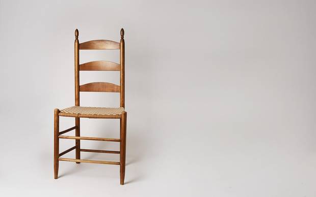 A circa 1910 ladder-back chair from the Shaker Museum.
