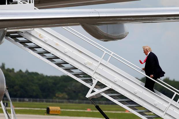 Donald Trump boards his plane following a campaign rally in Tampa, Florida, in August.