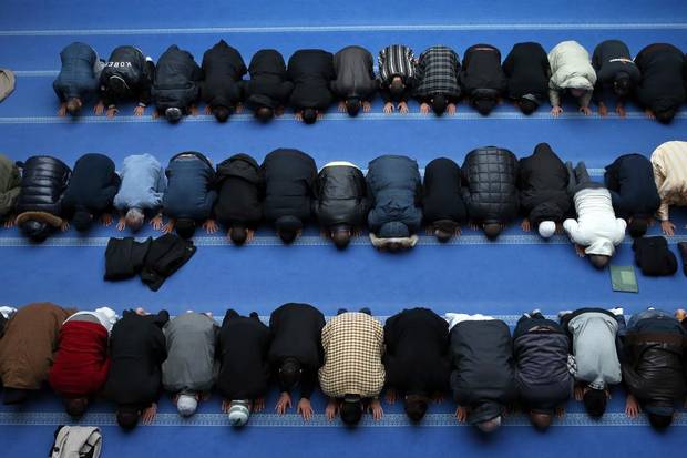 French Muslims pray at the mosque in Gennevilliers, a suburb north of Paris, on Jan. 8, 2015.
