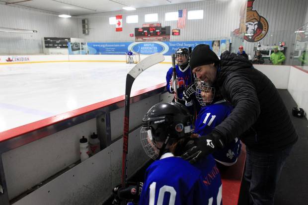 Nunavik Nordiks coach Joe Juneau talks to his players during a game March 24, 2017 in Ottawa. The Inuit girl's hockey team is in Ottawa for a tournament. DAVE CHAN / THE GLOBE AND MAIL