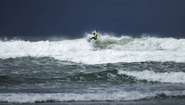 A surfer shreds a wave as he competes on the first day.