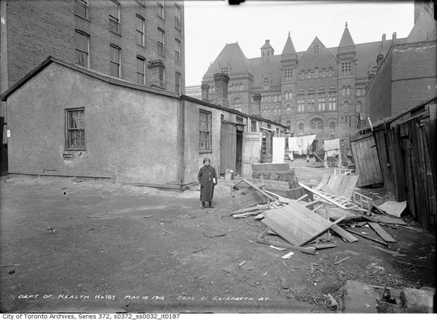 On May 15, 1913, the photographer Arthur Goss chronicled impoverished conditions in St. John’s Ward, including this photo, of a girl standing beside a tumbled down house with the old city hall in the background, has fascinated for years. Using an old street map, assessment records and a genealogy service, she has been identified as Dorothy Cooperman, born in Kiev around 1902, died in Michigan in 1979.