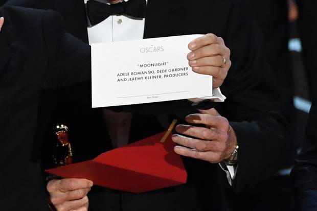 La La Land producer Jordan Horowitz holds up the winner card showing the actual Best Picture winner.
