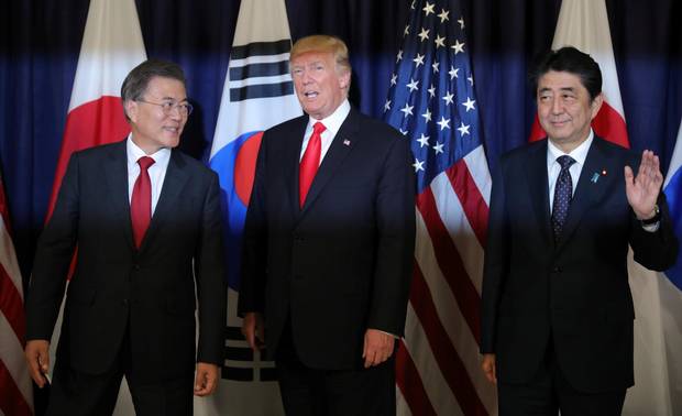 U.S. President Donald Trump meets South Korea's President Moon Jae-In (left) and Japanese Prime Minister Shinzo Abe (right) ahead the G20 leaders summit in Hamburg, Germany July 6, 2017.