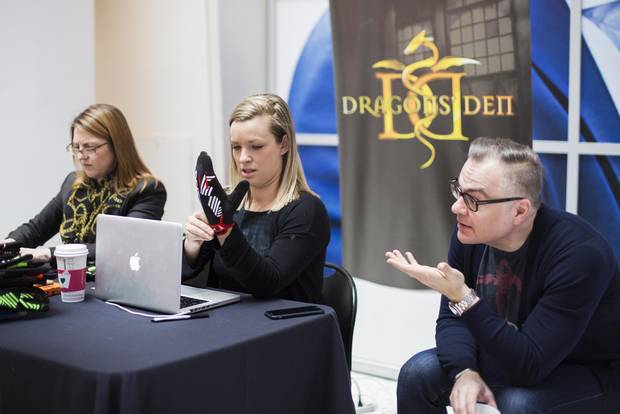 Dragons’ Den producer Michelle MacMillan, centre, tries on a glove designed for use with touchscreens during auditions for the show.
