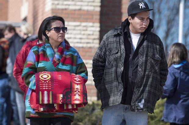 Ms. Baptiste, Colten's mother, and her son, Jace Baptiste, leave court during a break in proceedings on the first day of the preliminary hearing in North Battleford, Sask., in April 2017. 'This is a moment that will divide,' a family member said of the trial.