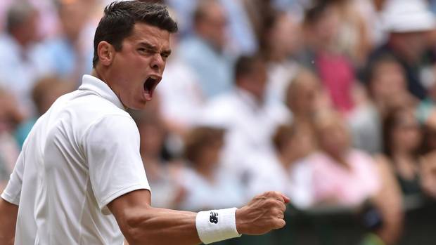Canada’s Milos Raonic celebrates winning the fourth set against Switzerland’s Roger Federer during their men’s semi-final match on the twelfth day of the 2016 Wimbledon Championships.