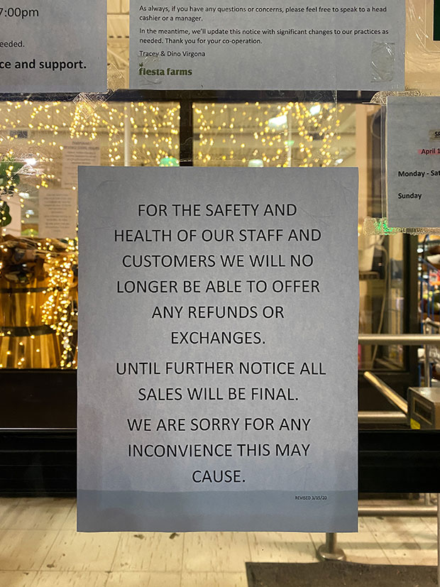 A sign reads 'for the safety and health of our staff and customers we will no longer be able to offer any refunds or exchanges.