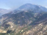 A wildfire burning near Lytton, B.C. is shown in a July 22, 2022 handout photo. The estimated size of the wildfire has been reduced thanks to more accurate mapping, however the BC Wildfire Service warns there's still a risk it will grow. THE CANADIAN PRESS/HO-BC Wildfire Service **MANDATORY CREDIT** 