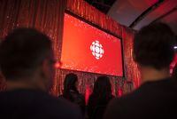 The CBC logo is projected onto a screen during the CBC's annual upfront presentation at The Mattamy Athletic Centre in Toronto, Wednesday, May 29, 2019. CBC personalities Carol Off, Mark Kelley, Nahlah Ayed and Jeannie Lee are among a growing number of staff urging the public broadcaster to drop efforts to sell more branded content. THE CANADIAN PRESS/Tijana Martin