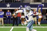 Dallas Cowboys quarterback Dak Prescott (4) celebrates after throwing a pass to Brandin Cooks, not pictured, for a two-point conversion in the second half of an NFL football game against the Seattle Seahawksin Arlington, Texas, Thursday, Nov. 30, 2023. (AP Photo/Roger Steinman)