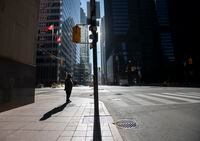 Pedestrians walking on Bay St. in Toronto's Financial District, are photographed on Nov 10 2020.