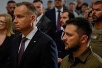 FILE PHOTO: Ukraine's President Volodymyr Zelenskiy and Polish President Andrzej Duda commemorate victims of World War II at the Saint Peter and Paul Cathedral, amid Russia's attack on Ukraine, in Lutsk, Ukraine July 9, 2023. REUTERS/Alina Smutko/File Photo