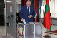 Belarus' President Alexander Lukashenko casts his ballot in the referendum on the constitutional amendments at a polling station in Minsk on February 27, 2022. (Photo by Nikolay PETROV / BELTA / AFP) / Belarus OUT (Photo by NIKOLAY PETROV/BELTA/AFP via Getty Images)