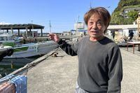 Masaki Nishide, a fisherman at the Satsugasaki port, describes the explosion scene Sunday April 16, 2023 at an election campaign event Prime Minister Fumio Kishida attended and narrowly escaped in Wakayma, western Japan. (AP Photo/Johnson Lai)