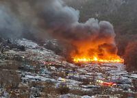 Smoke rises from a fire at Guryong village, the last slum in the glitzy Gangnam district, in Seoul, South Korea, January 20, 2023.    Yonhap via REUTERS