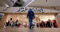 FILE - In this Nov. 24, 2017, file photo, a shopper heads into a J.C. Penney store in Seattle. Mall owners Simon Property Group and Brookfield Property Partners are close to a deal to buy department store chain J.C. Penney out of bankruptcy and keep the chain running, an attorney for Penney's announced Wednesday, Sept. 9, 2020. (AP Photo/Elaine Thompson, File)
