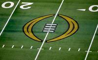 FILE - The College Football Playoff logo is shown on the field at AT&T Stadium before the Rose Bowl NCAA college football game between Notre Dame and Alabama in Arlington, Texas, Jan. 1, 2021. The university presidents who oversee the College Football Playoff voted Friday, Sept. 2, 2022, to expand the postseason model for determining a national champion from four to 12 teams no later than the 2026 season. (AP Photo/Roger Steinman, File)