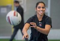 Magali Harvey, the 2014 Women’s Rugby Player of the Year, is in line for her first cap in almost five years when fourth-ranked Canada takes on No. 1 England in a rugby test match Saturday. Harvey tosses the ball during a demonstration session in Montreal on Wednesday, December 16, 2015. THE CANADIAN PRESS/Paul Chiasson