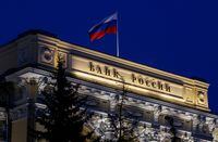 FILE PHOTO: National flag flies over the Russian Central Bank headquarters in Moscow, Russia May 27, 2022. REUTERS