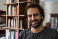 (FILES) In this file photo taken on May 17, 2019, Egyptian activist and blogger Alaa Abdel Fattah gives an interview at his home in Cairo. - Egypt on December 20, 2021 sentenced Alaa Abdel Fattah, a leading figure in the 2011 revolution, to five years in jail with two others receiving four years. Abdel Fattah, his lawyer Mohamed al-Baqer, and blogger Mohamed "Oxygen" Ibrahim were charged with "broadcasting false news" in their trial in Cairo. (Photo by Khaled DESOUKI / AFP) (Photo by KHALED DESOUKI/AFP via Getty Images)