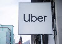 FILE PHOTO: The logo of Uber is seen at a temporary showroom at the Promenade road during the World Economic Forum (WEF) 2023, in the Alpine resort of Davos, Switzerland, January 20, 2023. REUTERS/Arnd Wiegmann/File Photo