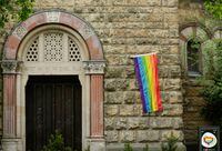 FILE PHOTO: A rainbow flag is seen on the wall of a Catholic church as the building is open for same-sex couples to receive a blessing in Cologne, Germany, May 10, 2021. REUTERS/Thilo Schmuelgen/File Photo
