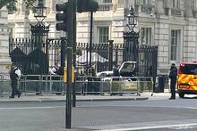 Police at the scene after a car collided with the gates of Downing Street in London Thursday May 25, 2023. Police say a car has collided with the gates of Downing Street in central London, where the British prime minister's home and offices are located. The Metropolitan Police force said there were no reports of injuries. (Ben Hatton/PA via AP)