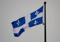 A Quebec trucking company has been ordered to reinstate a driver who was fired after she drank at least nine beers before losing control of her truck on a Pennsylvania highway. The Quebec flag flies on top of the legislature in Quebec City, Wednesday, Jan. 18, 2023. THE CANADIAN PRESS/Jacques Boissinot