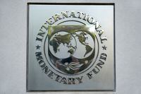 FILE PHOTO: International Monetary Fund (IMF) logo is seen at the IMF headquarters building during the IMF/World Bank annual meetings in Washington, U.S., October 14, 2017. REUTERS/Yuri Gripas