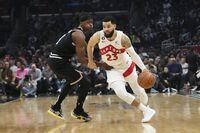 Toronto Raptors' Fred VanVleet (23) drives past Los Angeles Clippers' Terance Mann (14) during first half of an NBA basketball game Wednesday, March 8, 2023, in Los Angeles. (AP Photo/Jae C. Hong)
