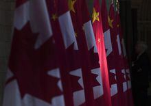 A Chinese flag is illuminated by sunshine in the Hall of Honour during an official visit on Parliament Hill in Ottawa, Thursday, Sept. 22, 2016. A former Canadian diplomat says that if the recent expulsion of a Canadian and Chinese diplomat from the other’s embassy is anything like his own, both are in for a discombobulating few days. THE CANADIAN PRESS/Adrian Wyld