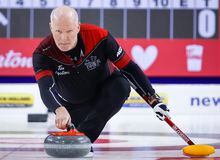 Team Ontario skip Glenn Howard makes a shot as he plays Team Wild Card Two at the Tim Hortons Brier in Lethbridge, Alta., Saturday, March 5, 2022.  Feeling "10 times better" after off-season knee surgery, the ageless Glenn Howard is feeling refreshed and energized as he aims to defend his team's title at the upcoming Ontario Tankard. THE CANADIAN PRESS/Jeff McIntosh