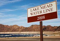 LAKE MEAD NATIONAL RECREATION AREA, NEVADA - MAY 09: A water line marker from the year 2008 is posted along drought-stricken Lake Mead on May 9, 2022 in the Lake Mead National Recreation Area, Nevada. The U.S. Bureau of Reclamation reported that Lake Mead, North America's largest artificial reservoir, has dropped to about 1,052 feet above sea level, the lowest it's been since being filled in 1937 after the construction of the Hoover Dam. Two sets of human remains have been discovered recently as the lake continues to recede. The declining water levels are a result of a climate change-fueled megadrought coupled with increased water demands in the Southwestern United States. (Photo by Mario Tama/Getty Images)