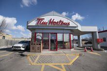 Vehicles line up at the Tim Horton drive thru shop on the Third Line on Dorval Rd. in Oakville, Ont. on Feb 15, 2022. Fred Lum 