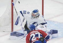 Montreal Canadiens' Jonathan Drouin (27) scores against Tampa Bay Lightning goaltender Andrei Vasilevskiy during first period NHL hockey action in Montreal, Tuesday, March 21, 2023. THE CANADIAN PRESS/Graham Hughes