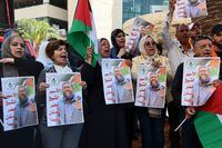 People hold portraits of Khader Adnan, a Palestinian Islamic Jihad militant who had been on hunger strike in an Israeli prison for nearly three months, during a rally following the announcement of his death, on May 2, 2023, in Nablus, in the occupied West Bank. - Israel's prison service announced the death of the detainee affiliated to Islamic Jihad, who was "found early this morning in his cell unconscious". Adnan, 45, was the first Palestinian to die as a direct result of a hunger strike, according to the Palestinian Prisoners' Club. (Photo by Zain Jaafar / AFP) (Photo by ZAIN JAAFAR/AFP via Getty Images)