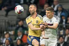 Vancouver Whitecaps FC's Ranko Veselinovic (right) battles with Real Salt Lake's Justin Meram for the loose ball during second half MLS soccer action in Vancouver, B.C., Saturday, February 25, 2023. THE CANADIAN PRESS/Rich Lam