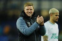 Newcastle's head coach Eddie Howe, centre, celebrates after the English Premier League soccer match between Everton and Newcastle United at the Goodison Park stadium in Liverpool, England, Thursday, April 27, 2023. (AP Photo/Jon Super)